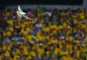 A dove flies after being released before the start of the 2014 World Cup opening match between Brazil and Croatia at the Corinthians arena in Sao Paul